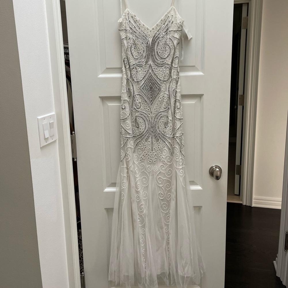 NWT Camille Sequin Beaded White Gown Sz: 8
Fits more like a 4.